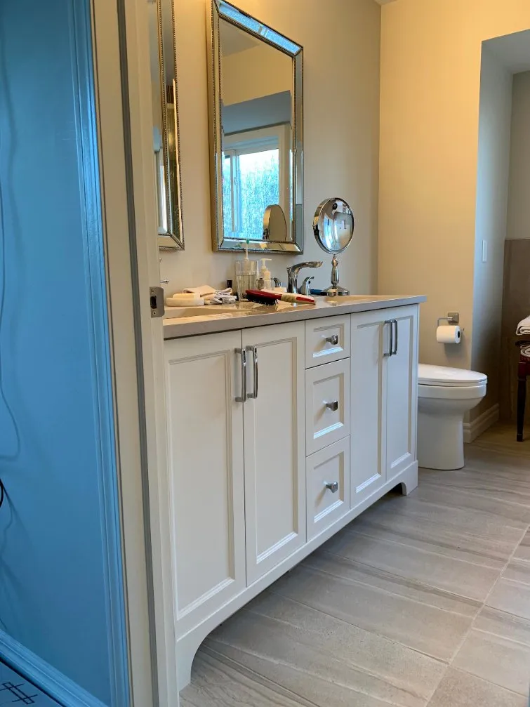 Bathroom with painted walls and white vanity in Calgary