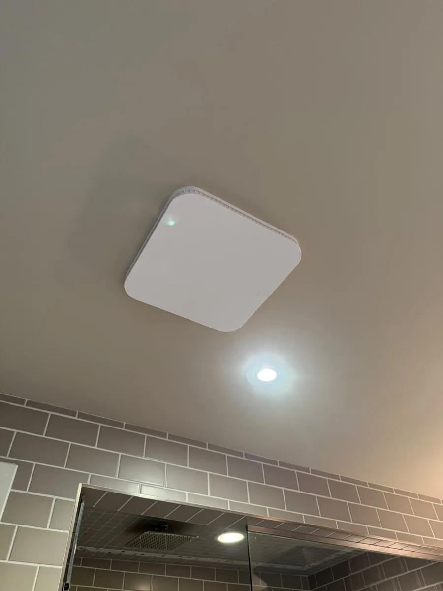 Bathroom ceiling vent cover installed after drywall repair, Calgary