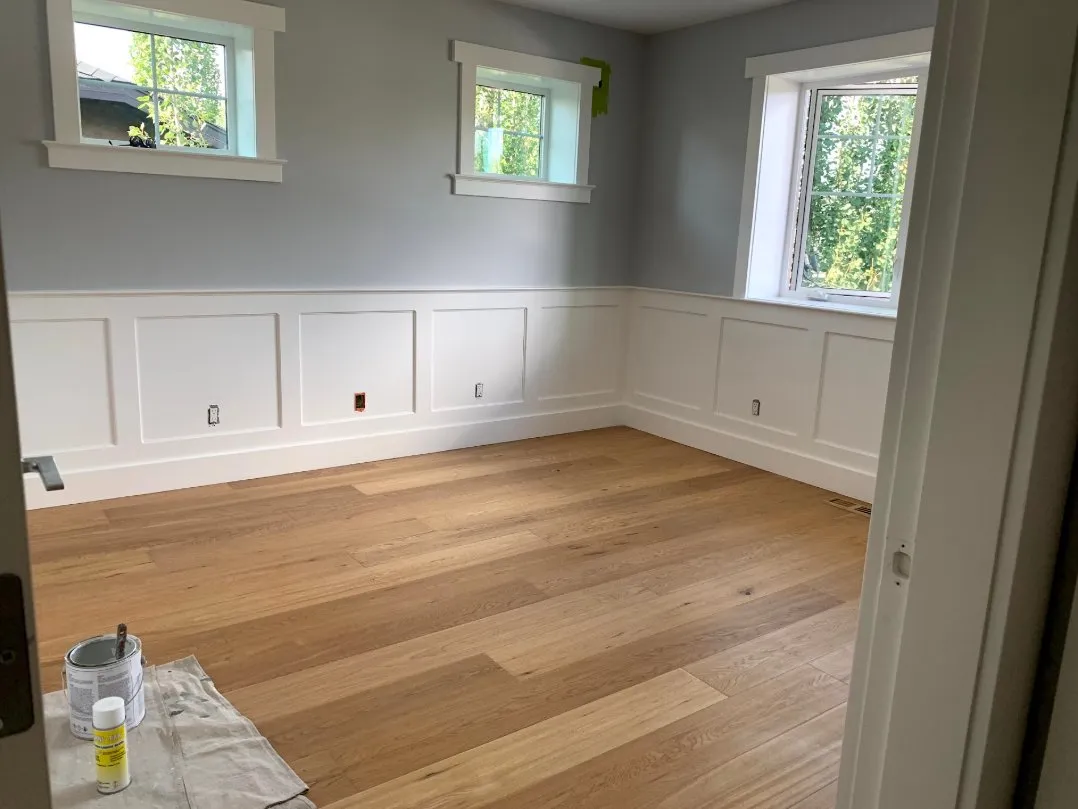 Bedroom with painted walls and white wainscoting in Calgary