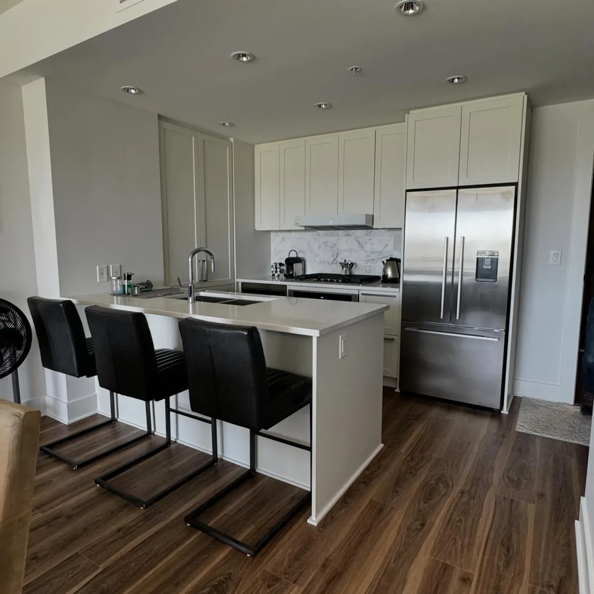 Finished kitchen cabinets after refinishing in Bridgeland, Calgary