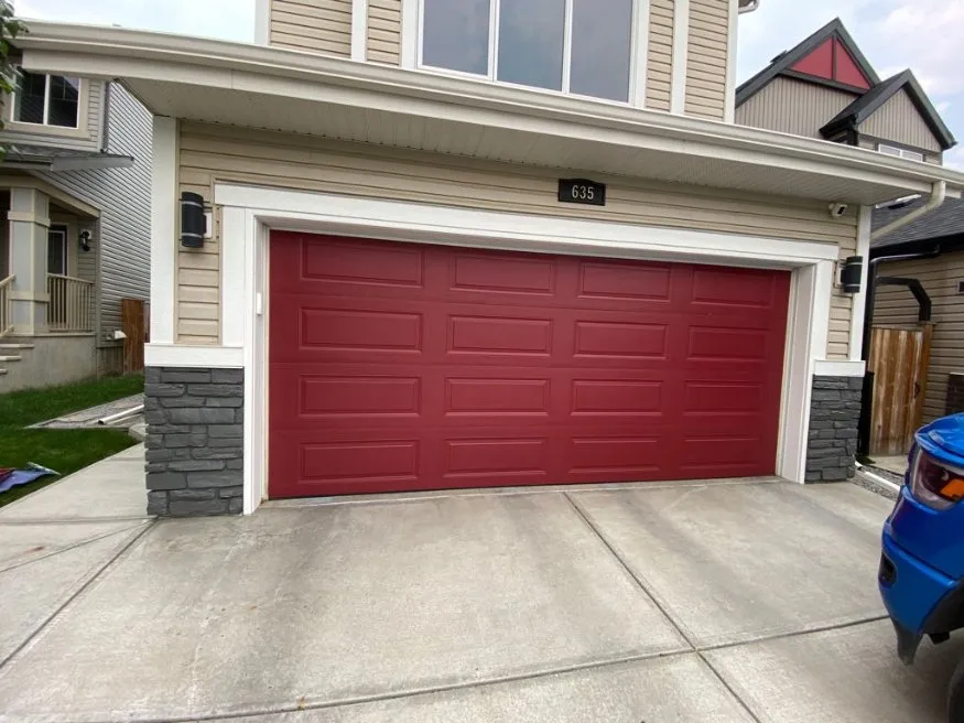 Red painted garage door on a Calgary home