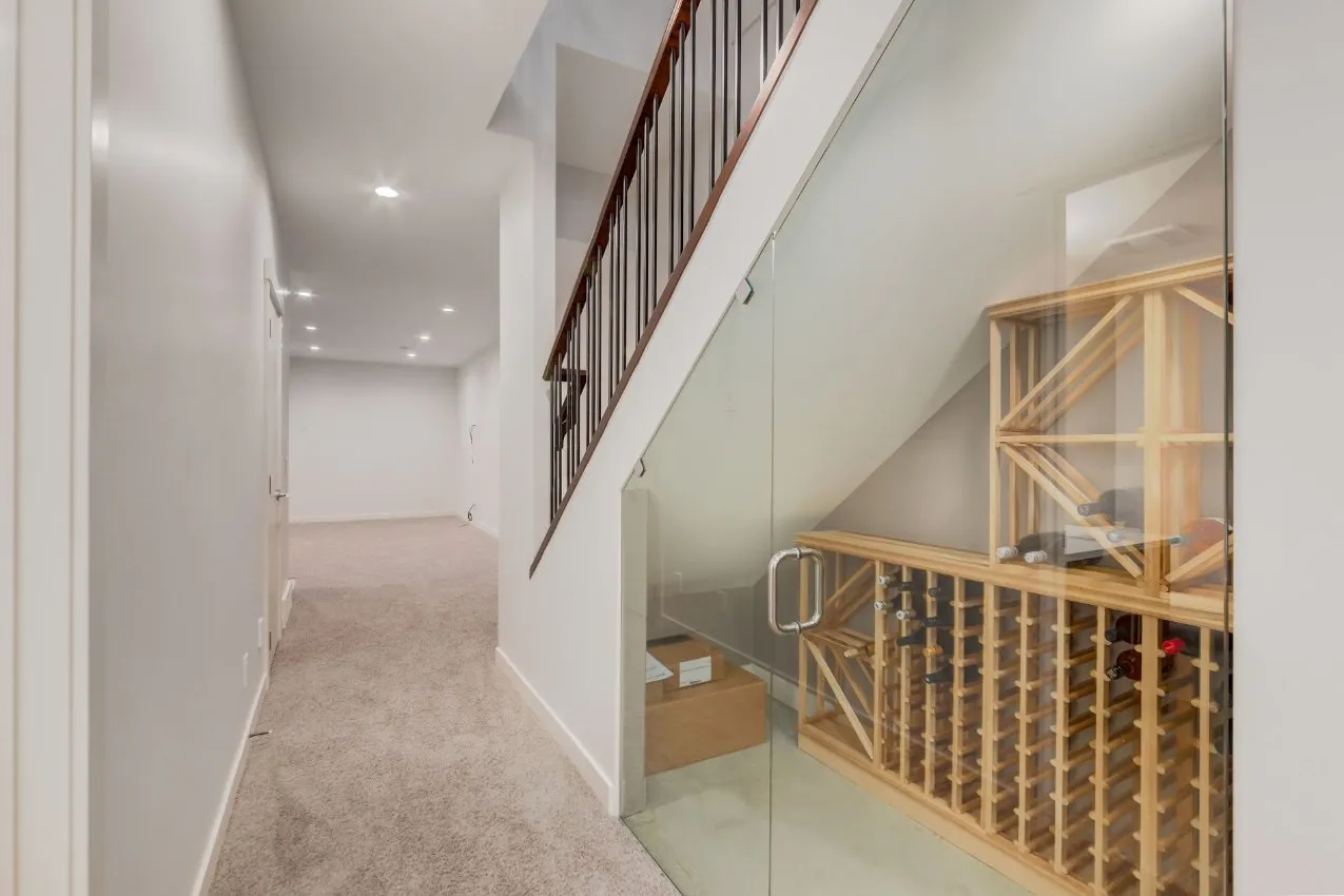 Hallway with fresh paint and glass wine cellar in Calgary