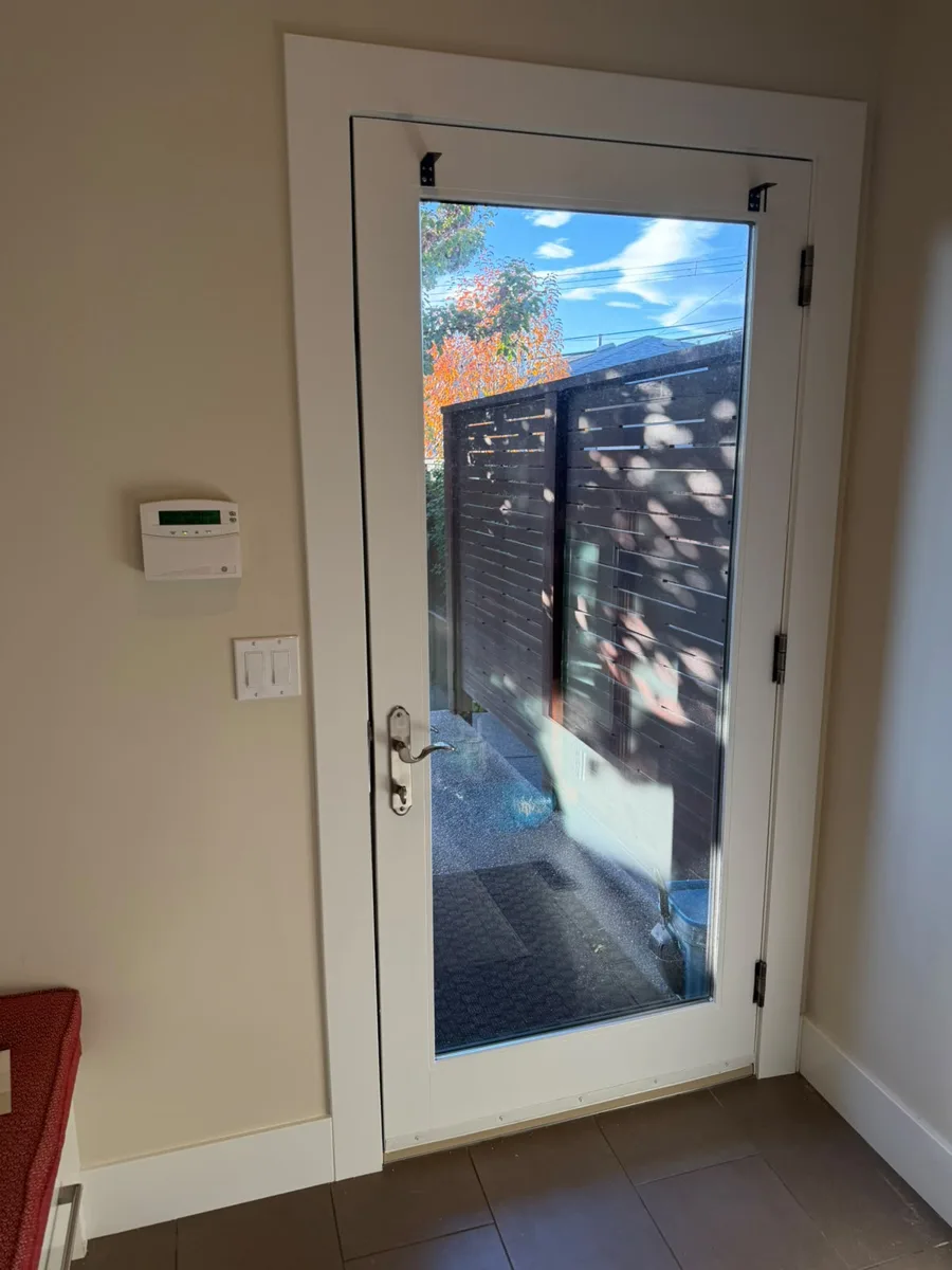 Interior door with a fresh coat of white paint, Calgary