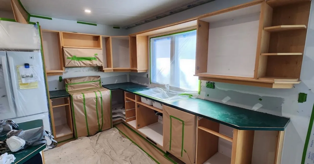 Kitchen cabinets painted in Midnight blue (Behr Marquee) by MV Painting Inc., Calgary