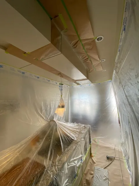 Kitchen sealed in a spray enclosure for on-site cabinet frame spraying, Calgary