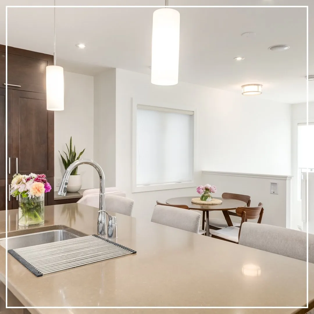 Open kitchen and dining area with fresh paint in Calgary