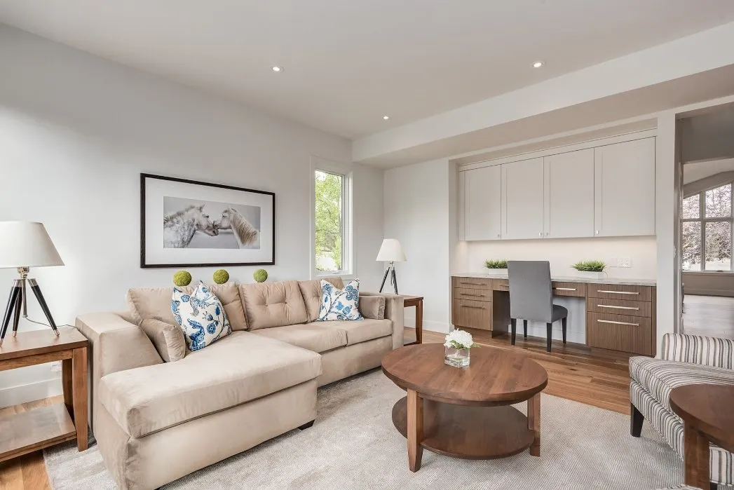 Living room with painted walls and home office nook in Calgary