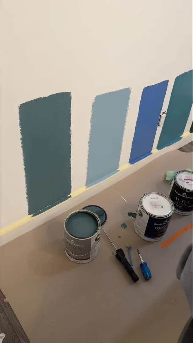 Paint colour samples tested on wall to help choose the right shade, Calgary