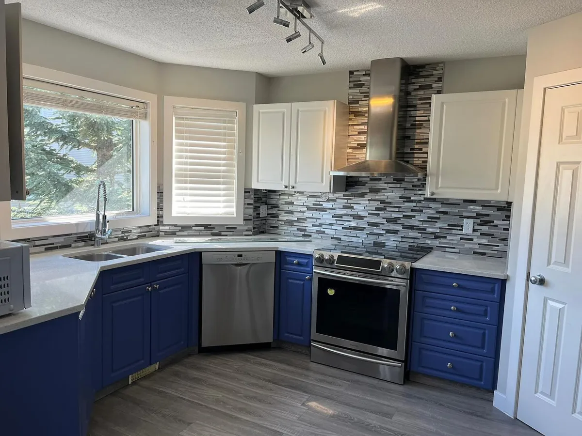 Finished two-tone kitchen cabinets, Calgary