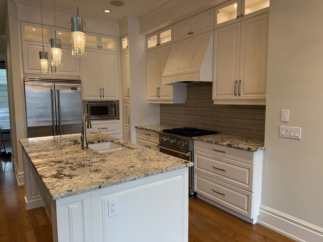 Refinished kitchen cabinets and range wall in Altadore, Calgary