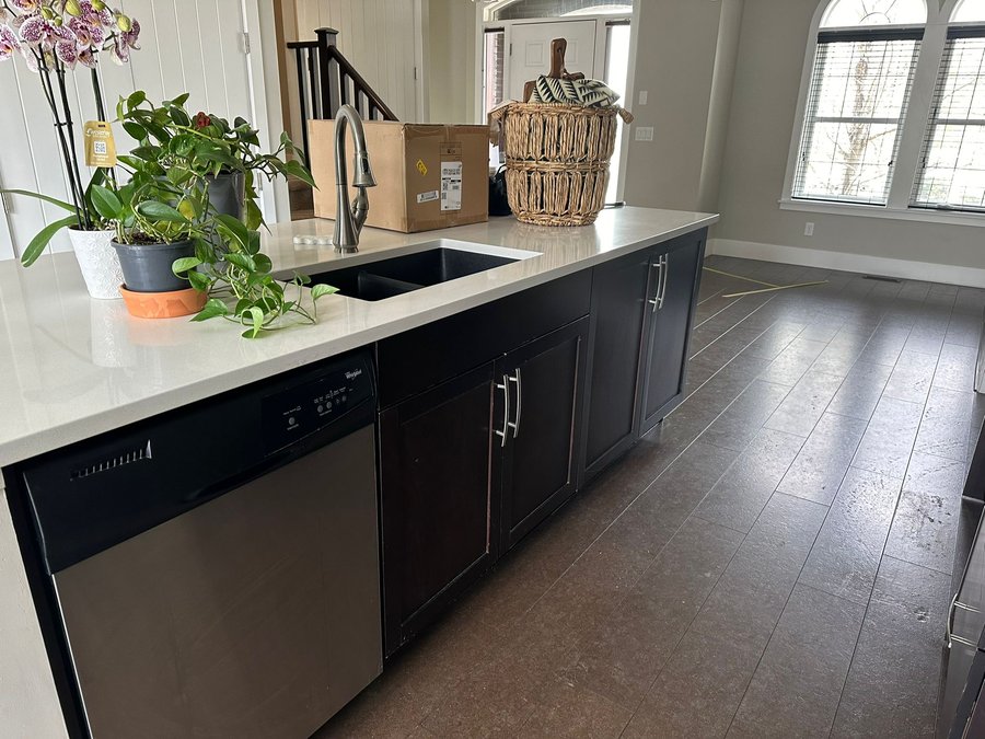 Kitchen island with dark espresso cabinets before refinishing