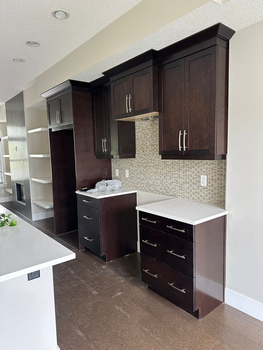 Dark espresso kitchen cabinets before a colour change in Calgary