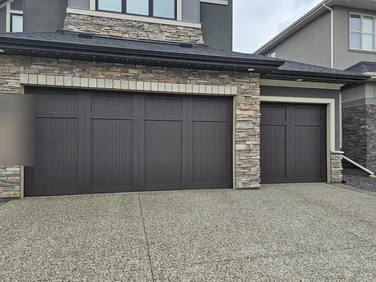 Garage doors refinished in Cordovan Brown in Cougar Ridge, Calgary
