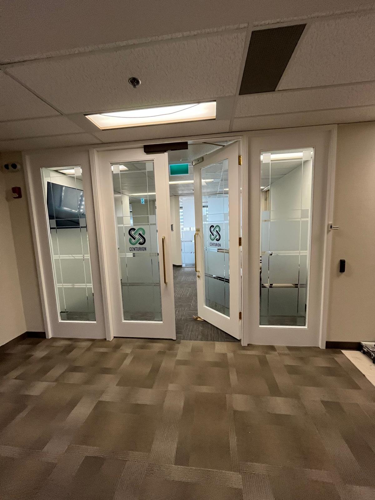 Refinished commercial door in Downtown Calgary