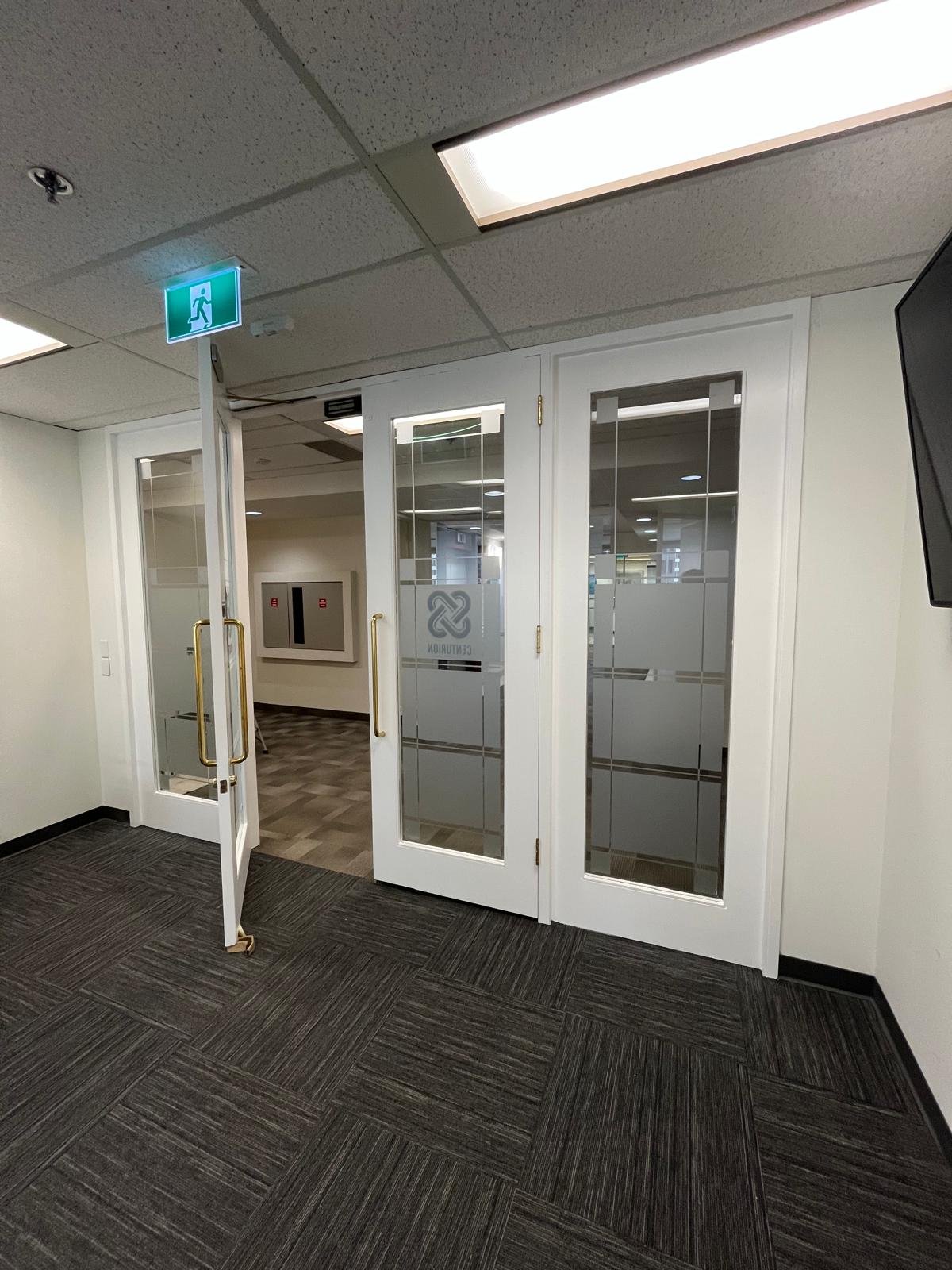 Refinished commercial door in Downtown Calgary