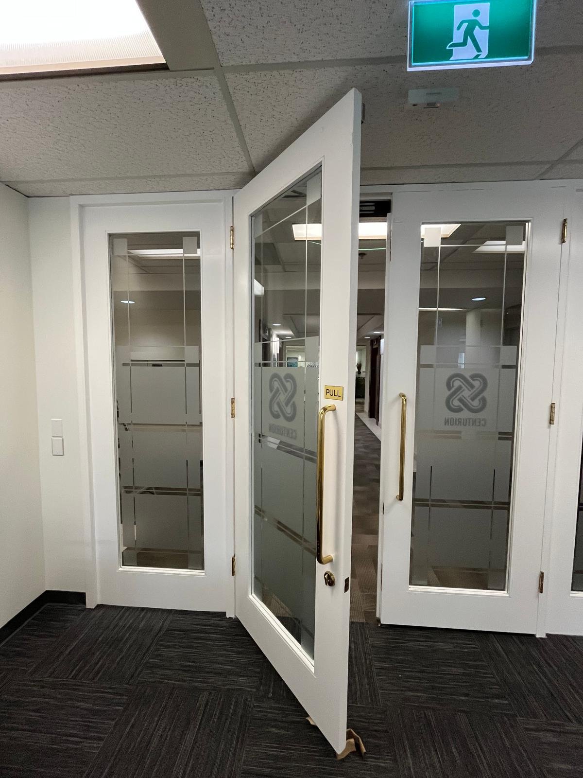 Refinished commercial door in Downtown Calgary