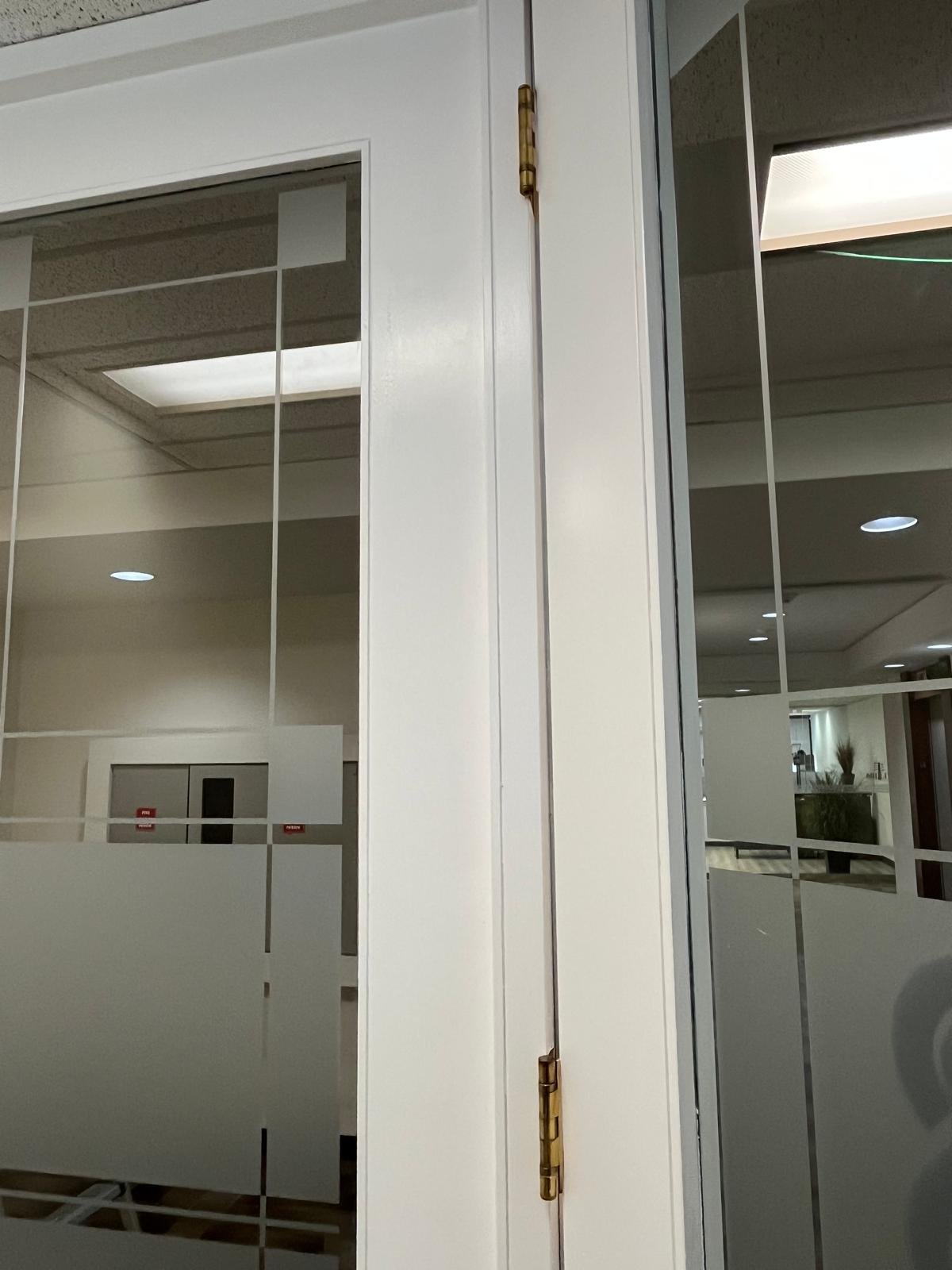 Refinished commercial door in Downtown Calgary