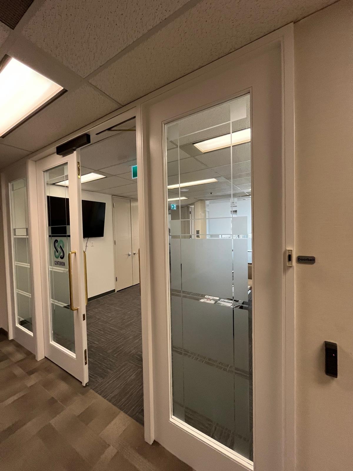 Refinished commercial door in Downtown Calgary
