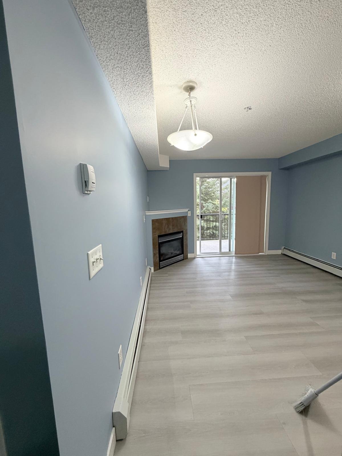 Repainted living room in an Evergreen condo, Calgary