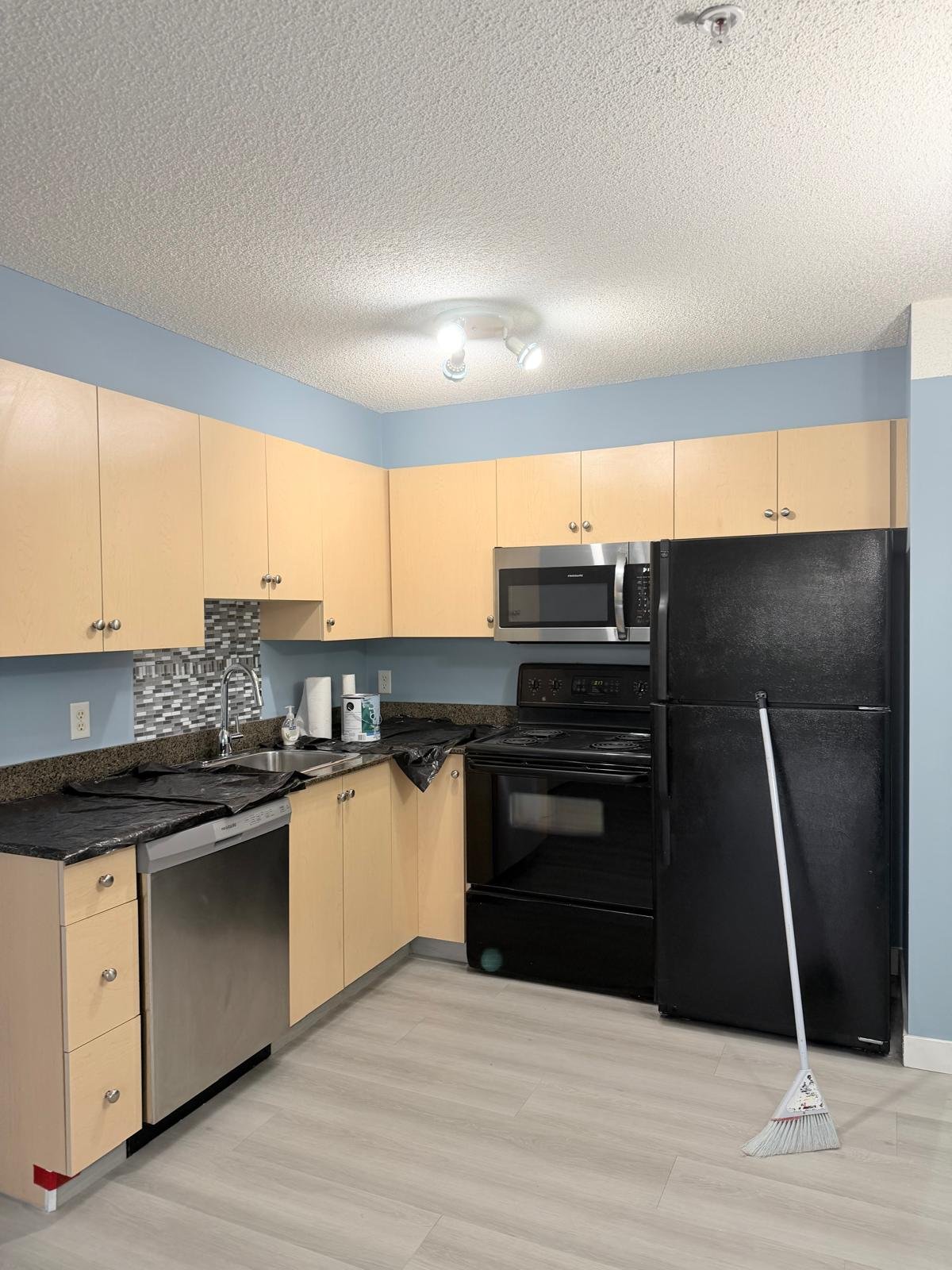 Repainted kitchen in an Evergreen condo, Calgary