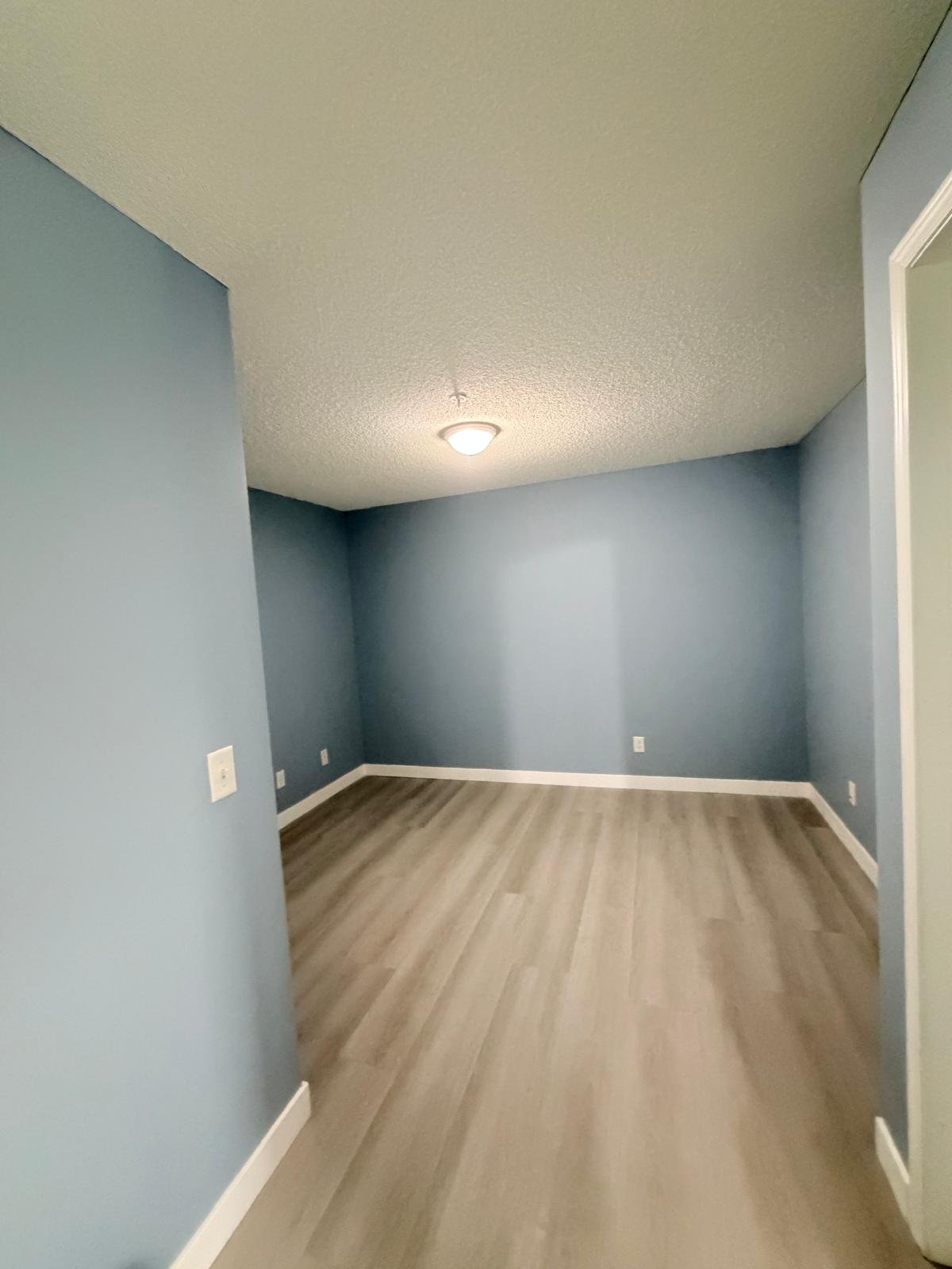 Repainted bedroom in an Evergreen condo, Calgary