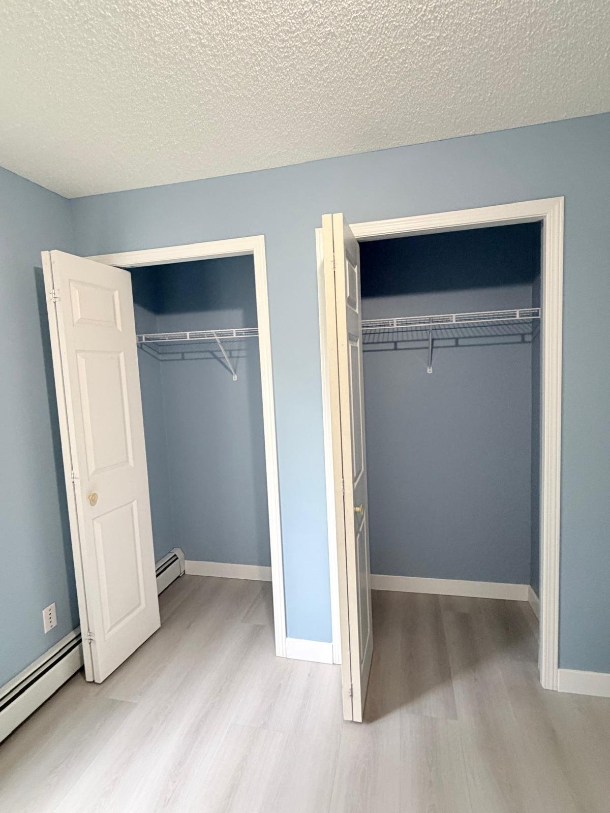 Repainted closet doors in an Evergreen condo, Calgary