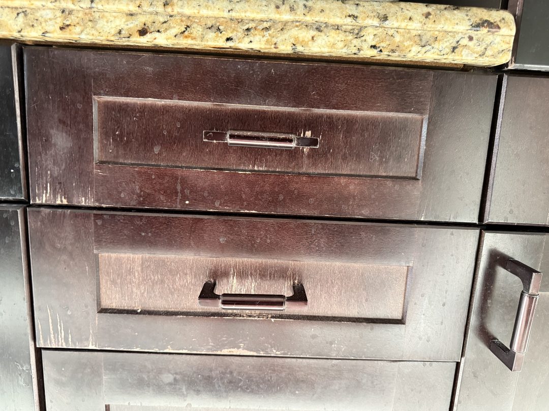 Worn espresso cabinet doors and drawers before refinishing in Maple Ridge, Calgary
