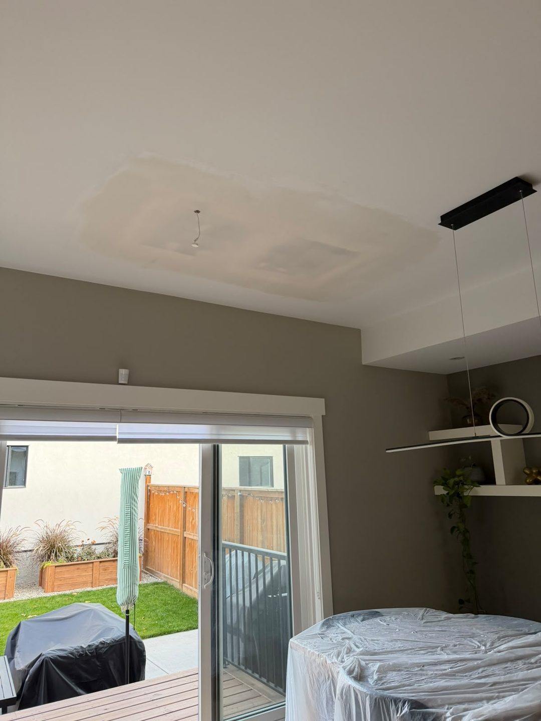 Primed ceiling patch ready for paint in Mount Pleasant, Calgary