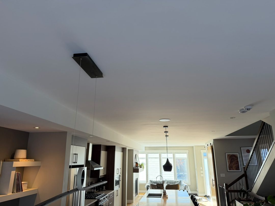 Finished smooth repainted ceiling in Mount Pleasant, Calgary, wide view