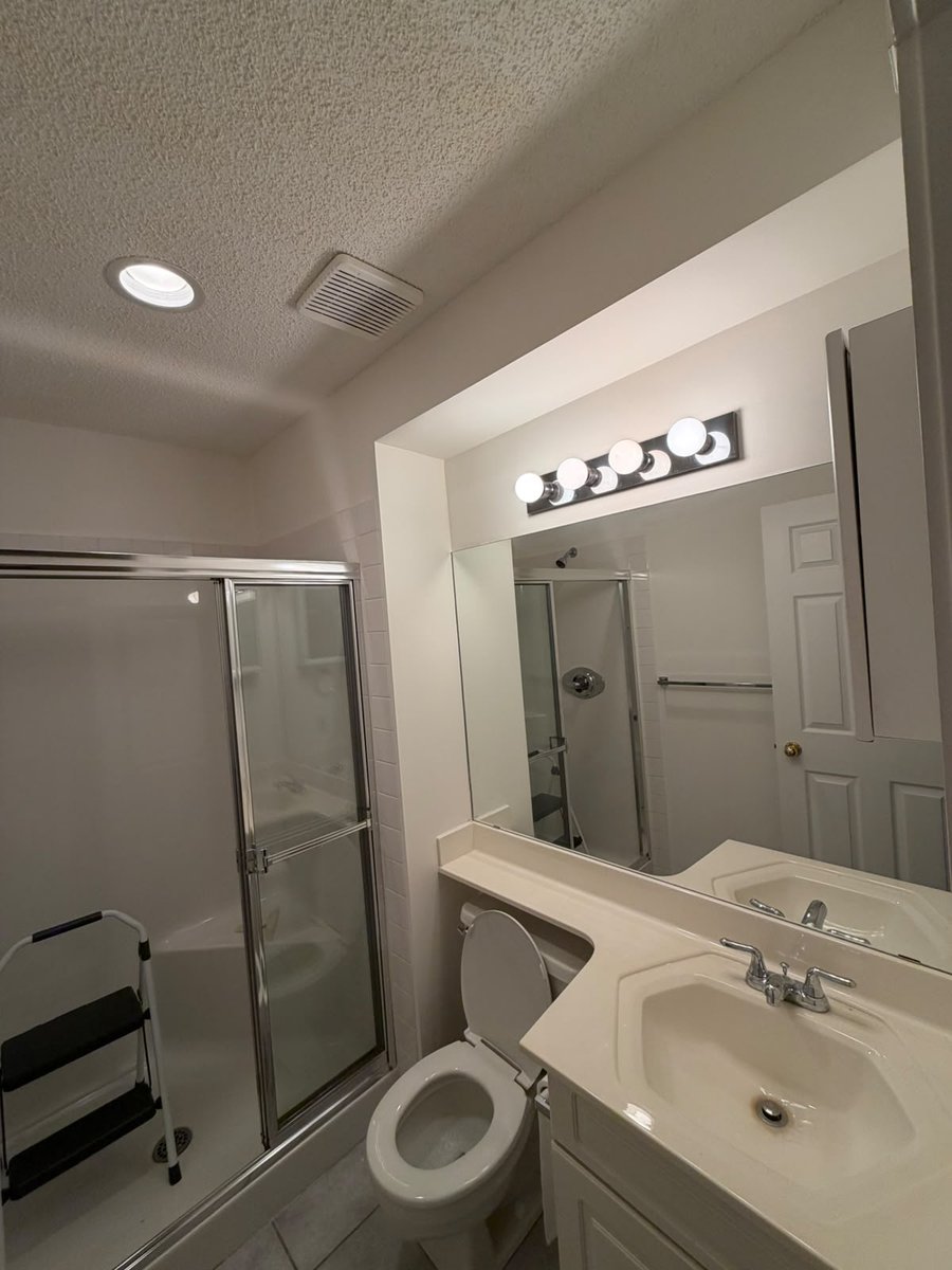 Bathroom repainted in Benjamin Moore Simply White in Mount Pleasant, Calgary