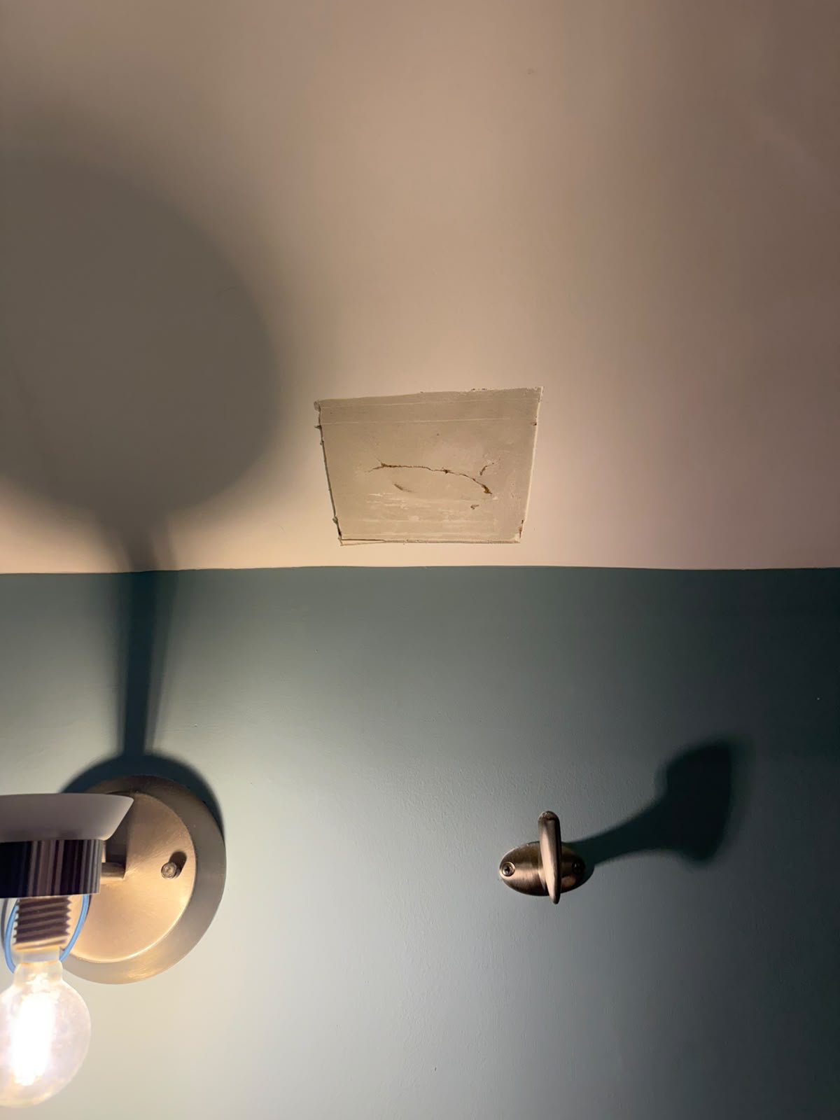 Dried mud on a bathroom ceiling repair in Oakridge, Calgary