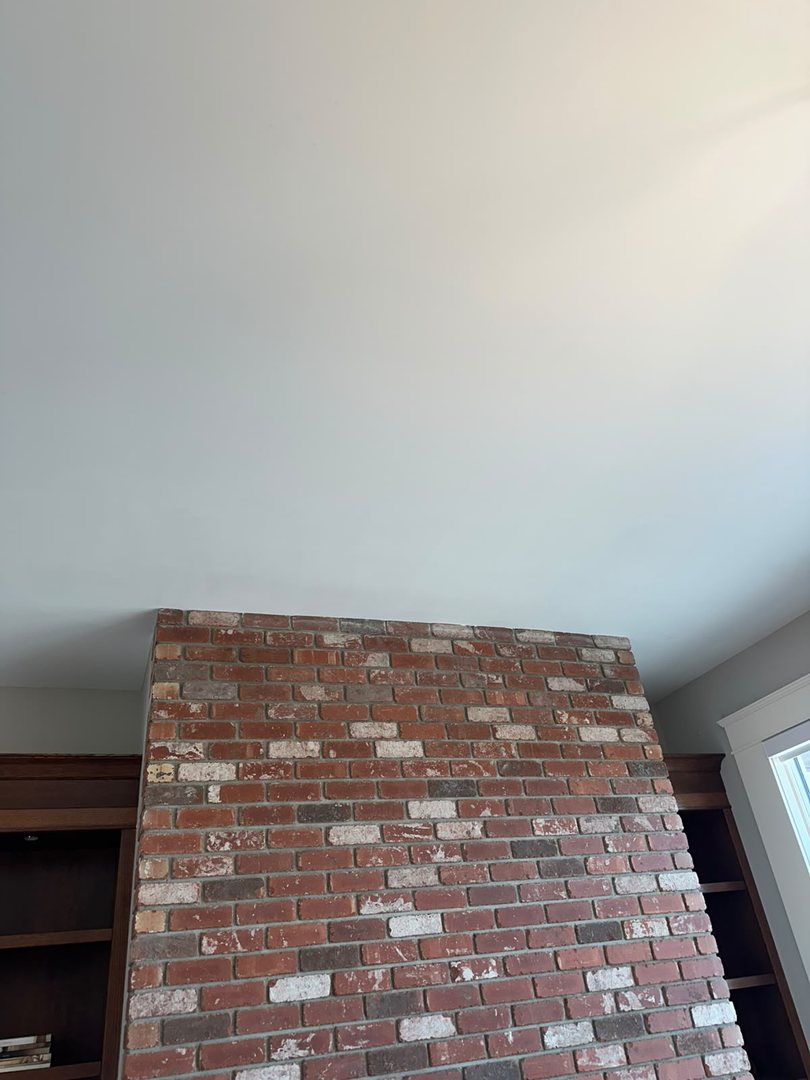 Finished smooth ceiling repainted with colour-matched paint in Rocky View County, Alberta