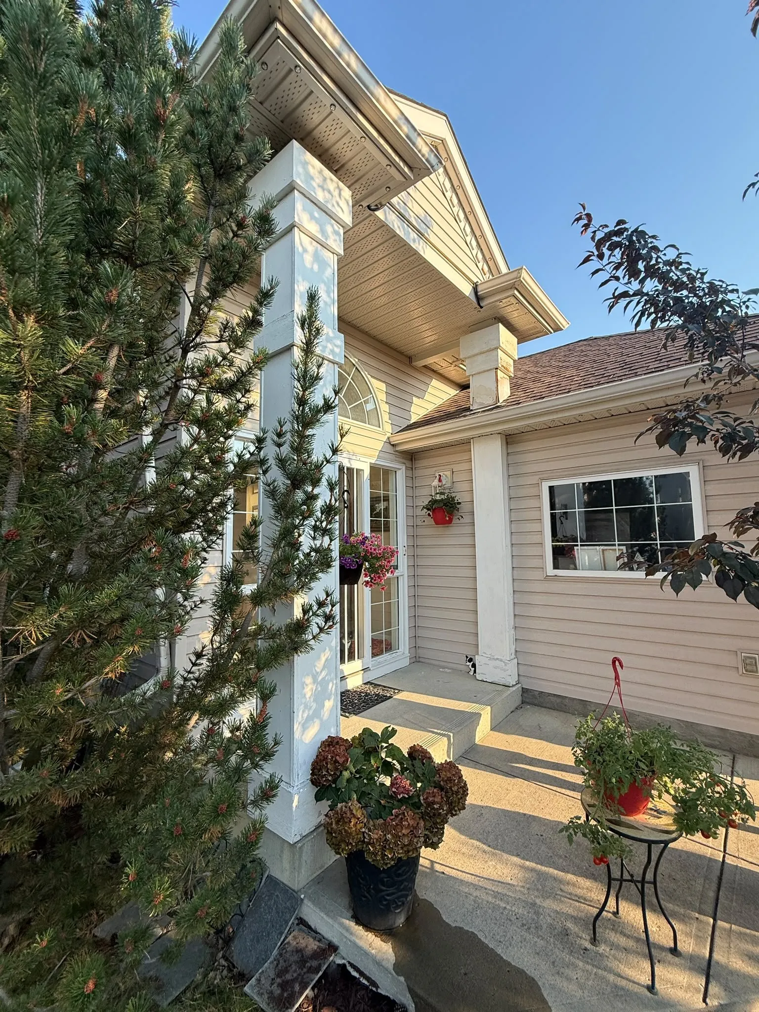 Repainted exterior trim on a home in Signal Hill, Calgary