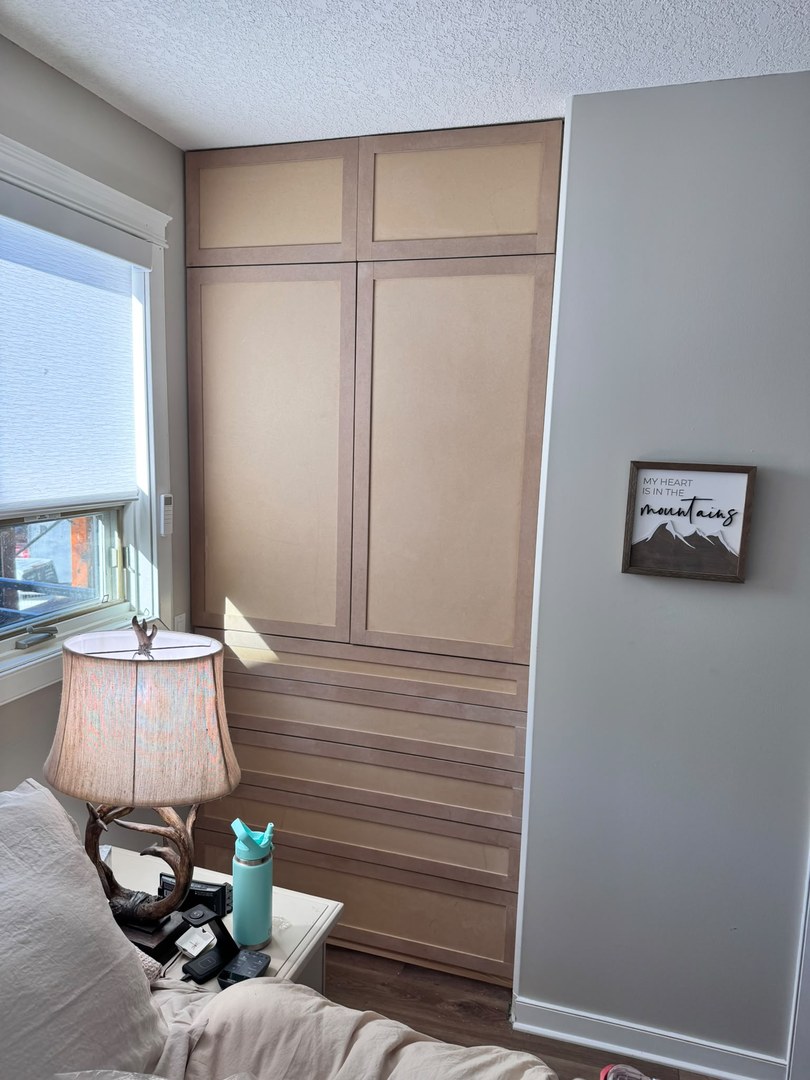 Sprayed built-in drawers and doors with a smooth white finish in Three Sisters, Canmore