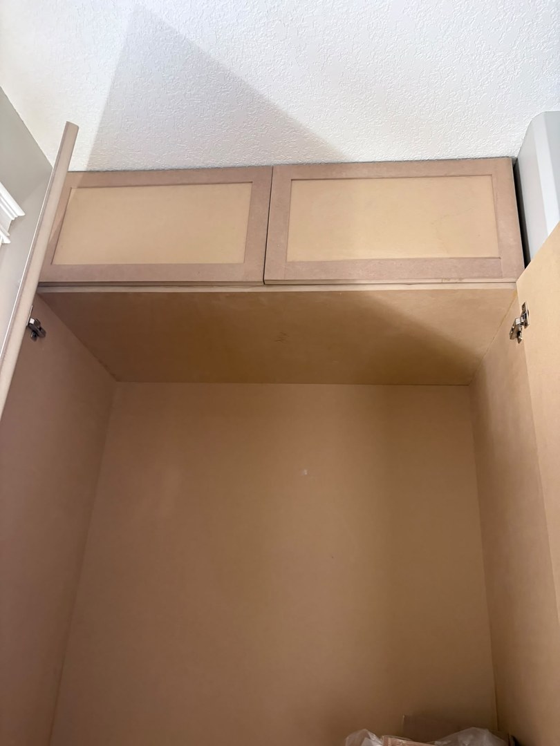 Raw MDF cabinet interior before spray-painting in Three Sisters, Canmore