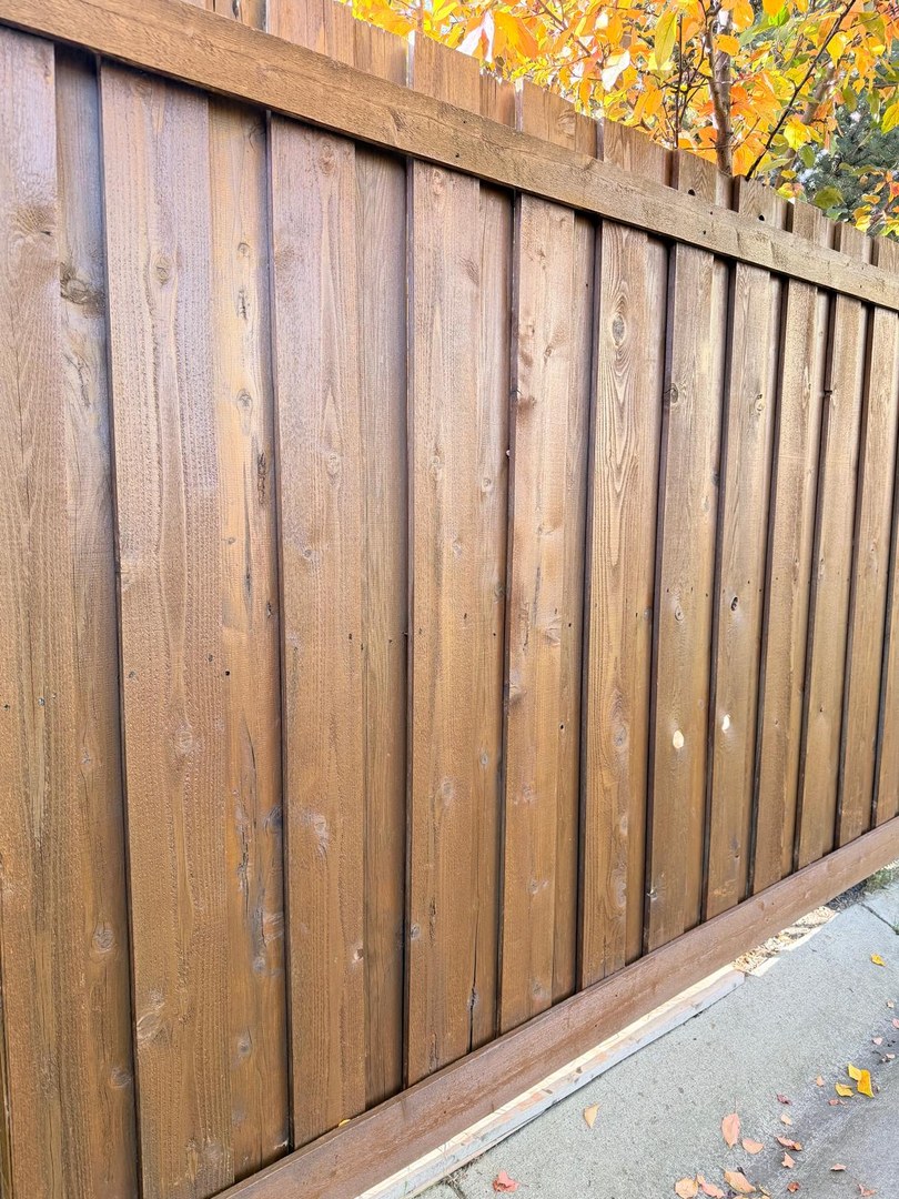 Full length of stained fence in Springbank Hill, Calgary