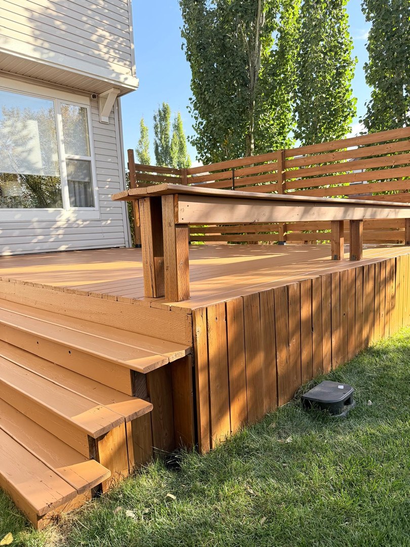 Stained deck stairs and built-in bench in Springbank Hill, Calgary