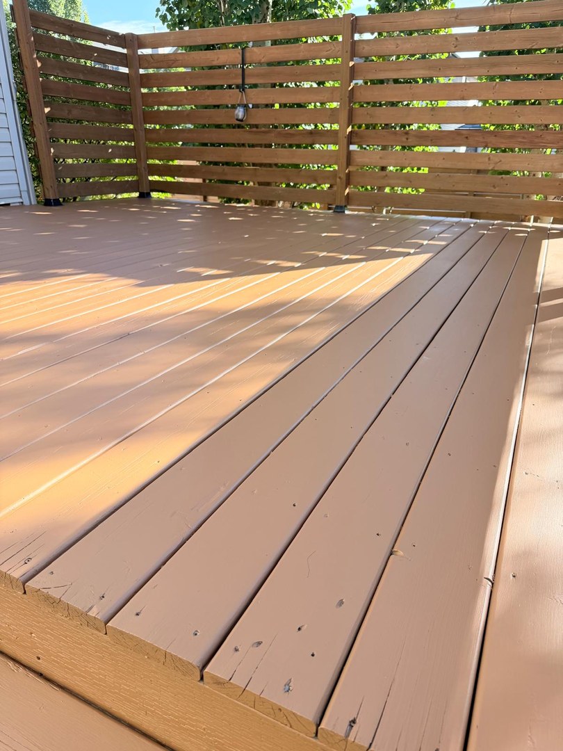 Stained deck boards close-up in Springbank Hill, Calgary
