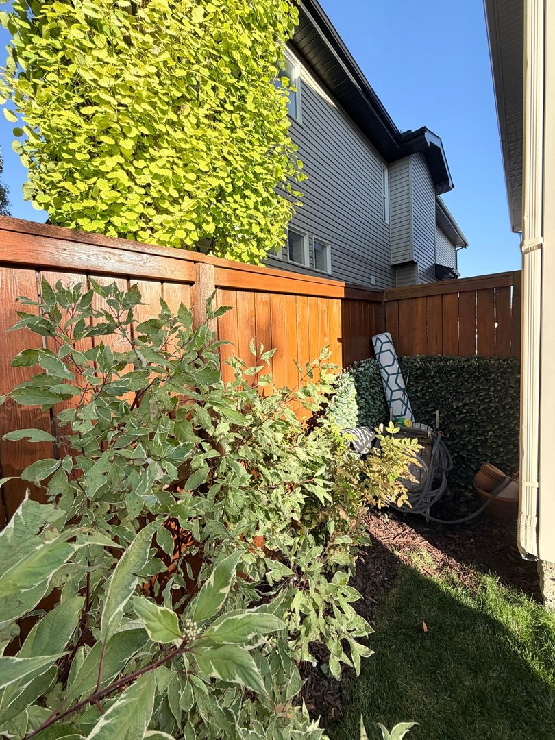 Stained fence corner in Springbank Hill, Calgary