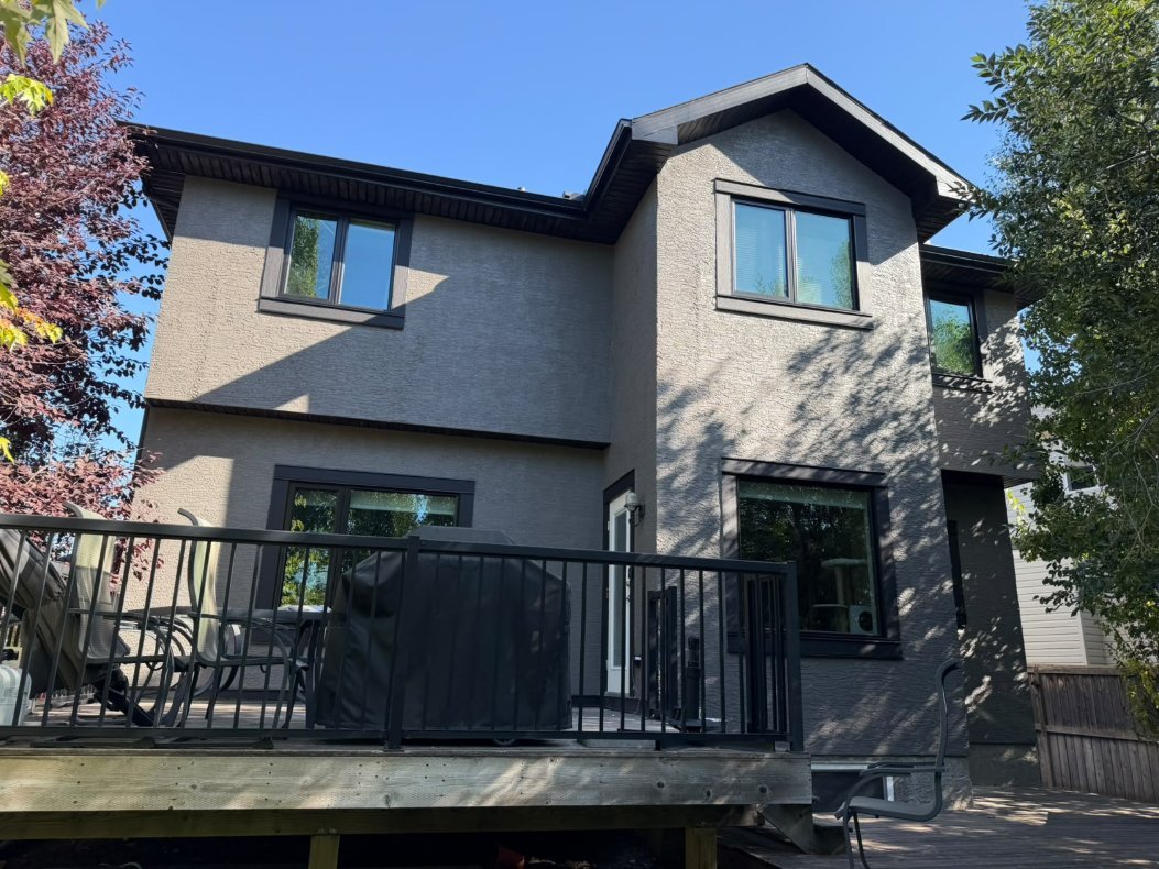 Detail of freshly sprayed stucco in West Springs, Calgary