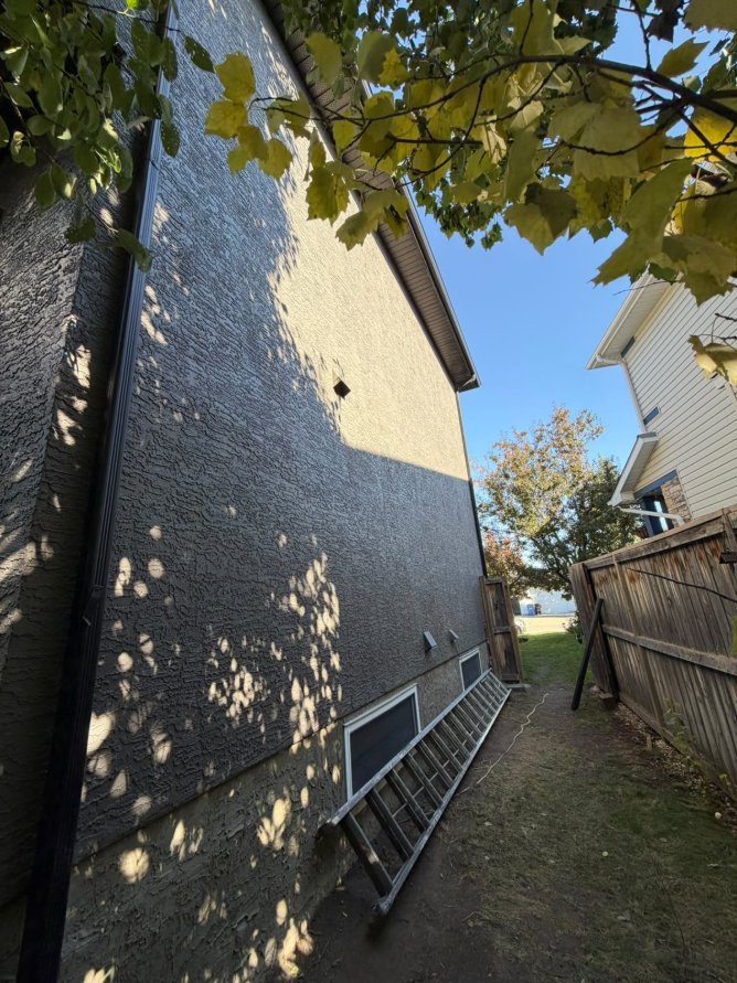 Detail of freshly sprayed stucco in West Springs, Calgary