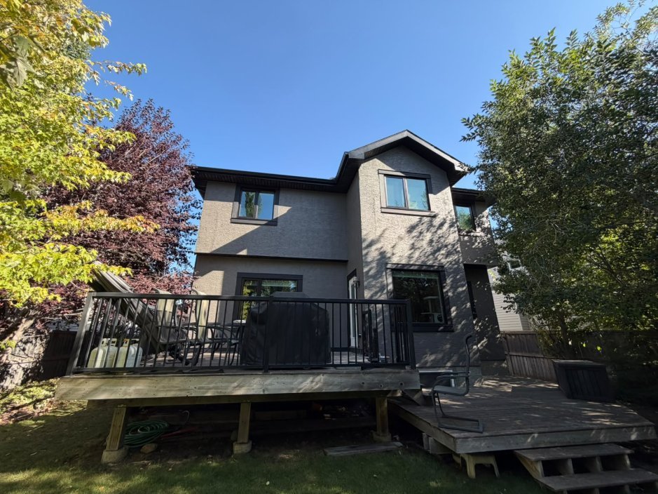 Finished sprayed stucco at the back of a home in West Springs, Calgary