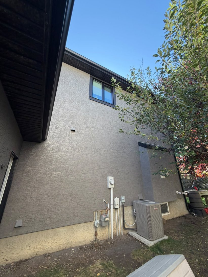 Detail of freshly sprayed stucco in West Springs, Calgary
