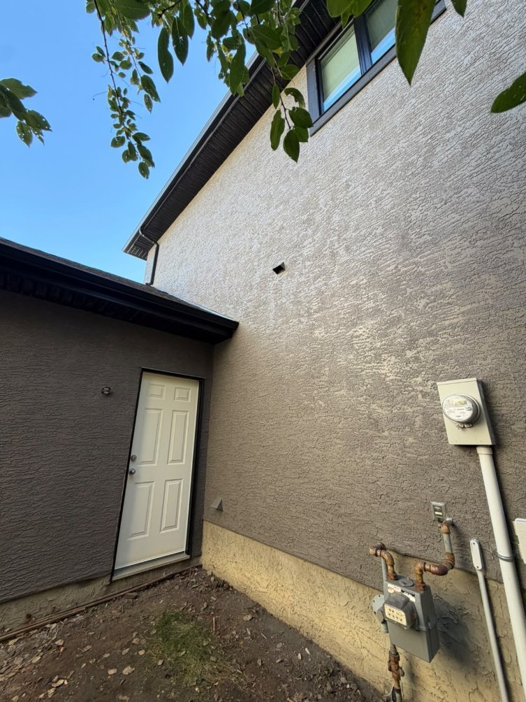 Detail of freshly sprayed stucco in West Springs, Calgary