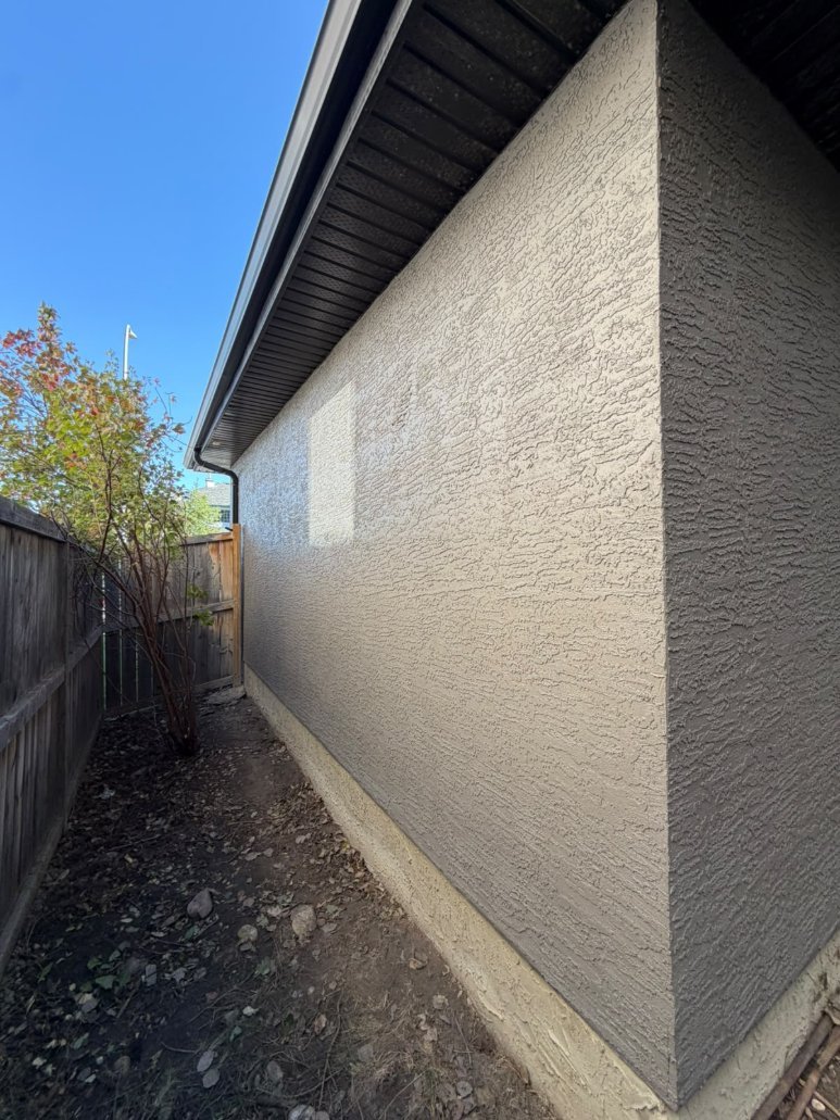 Detail of freshly sprayed stucco in West Springs, Calgary