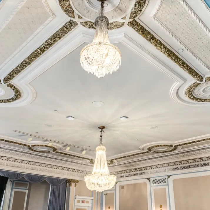 Ornamental painted ceiling with chandeliers in a commercial space in Calgary