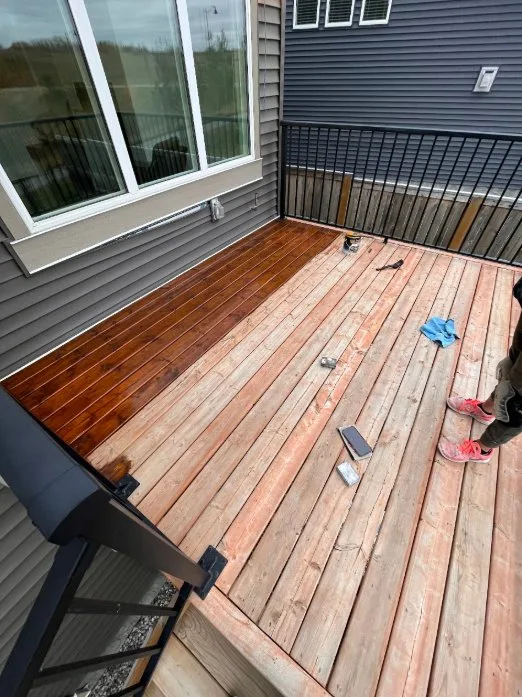 Wooden deck being stained by MV Painting Inc. in Calgary
