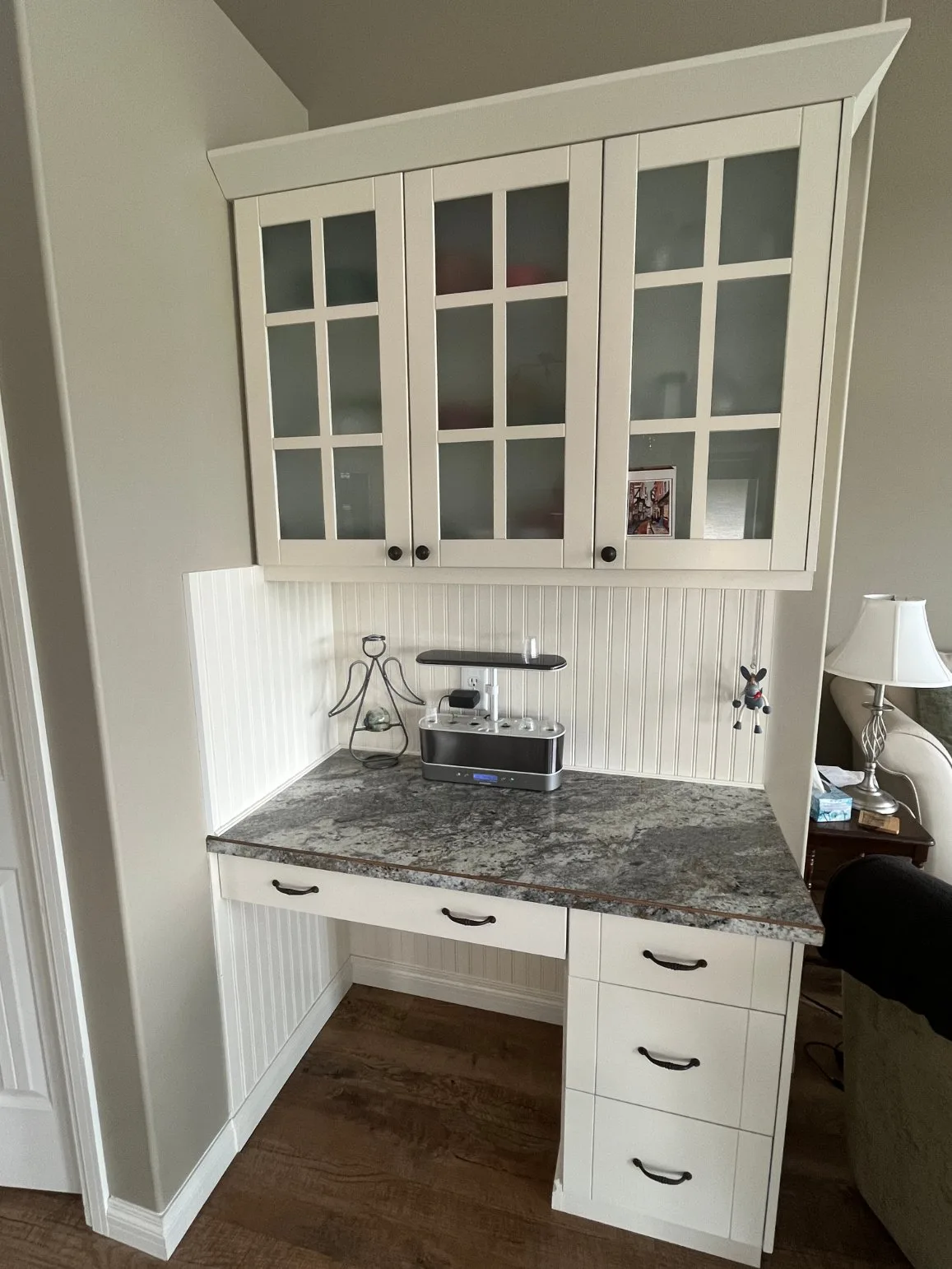 Painted built-in desk with glass cabinets in Calgary