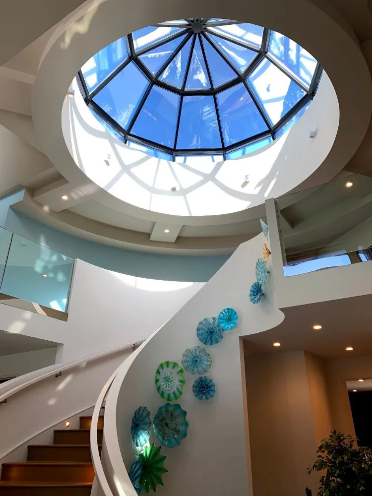 Painted staircase with glass dome skylight in Calgary