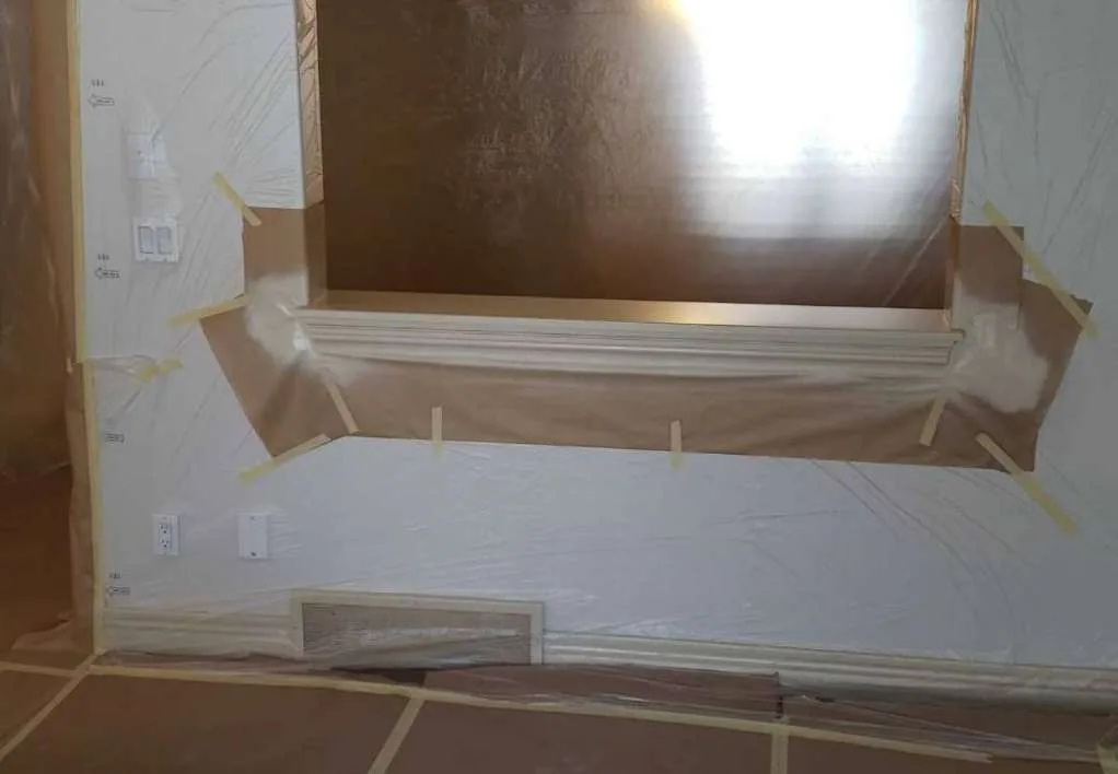 Window frame masked and prepped for painting in Calgary